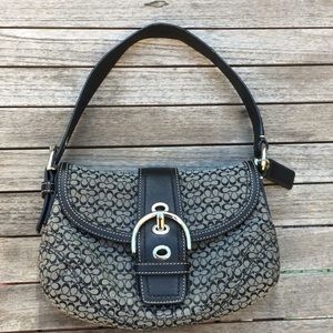 Never worn coach black purse with buckle